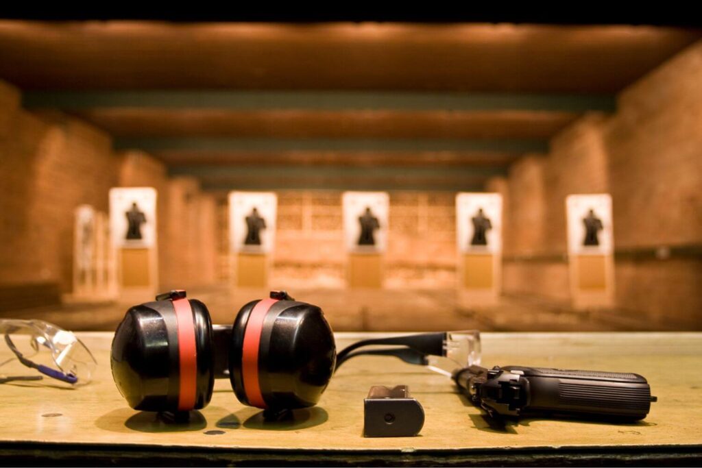 Gun and Accessories Laid out on a Table at a Gun Range