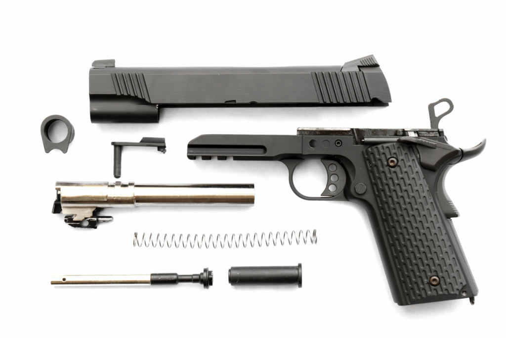 Gun dismantled with all of its pieces laid out