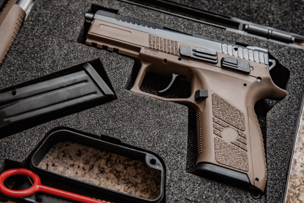 gun resting in a secure gun case with magazine