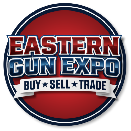 Circular Logo for the Eastern Gun Expo Featuring a Red Center Dark Blue Border and a White Banner That Reads buy Sell Trade